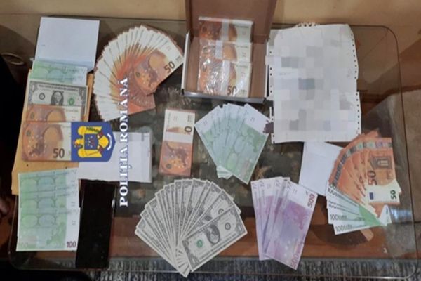 Percheziții în 16 județe și Capitală, într-un dosar de punere în circulație de bancnote contrafăcute